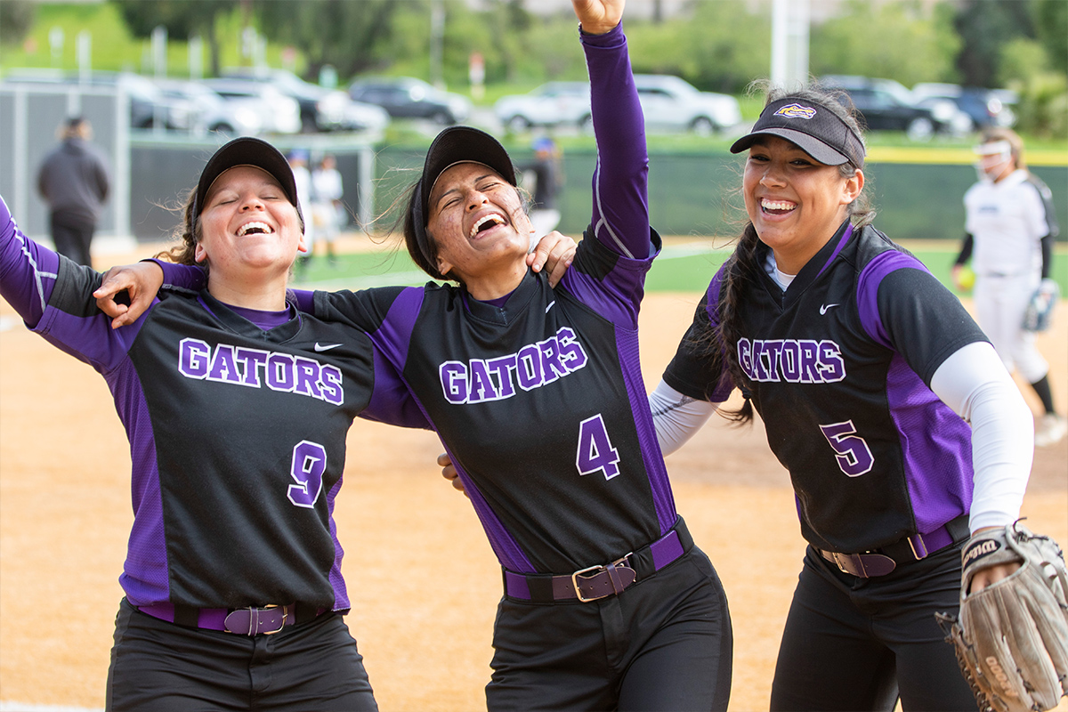 Softball players celebrating