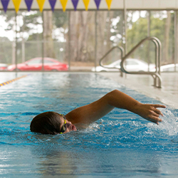 SF State student swimming in rec pool