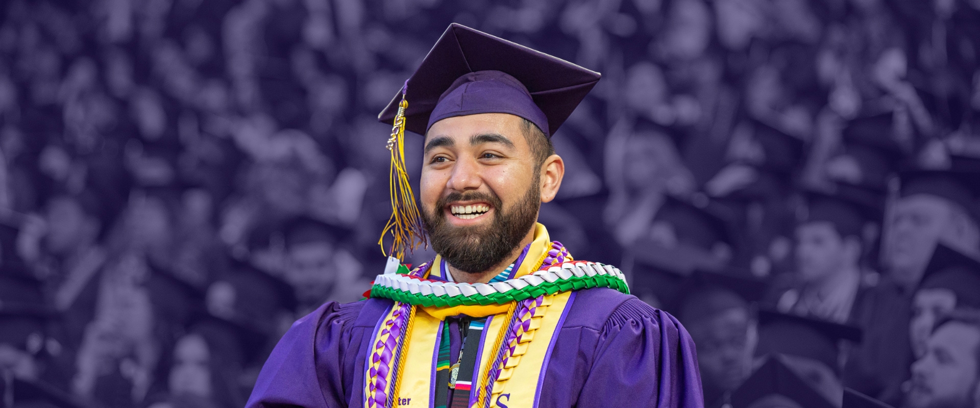 Student sticking out from crowd at Commencement