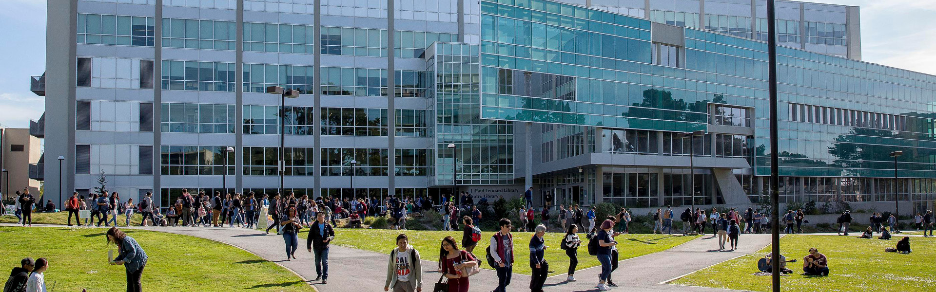 People walking in front of a building